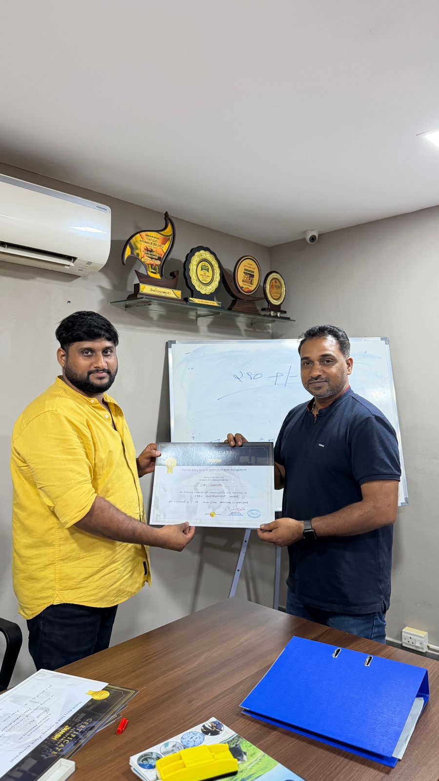 Training certificate distribution at Danish Dairy Farm